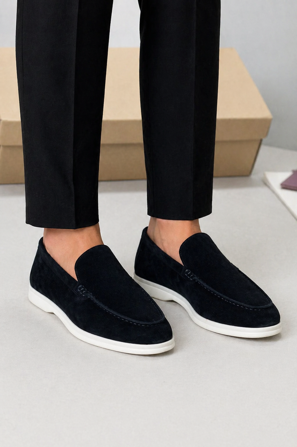 Men's slip-on loafers with moc toe stitching and low white soles
