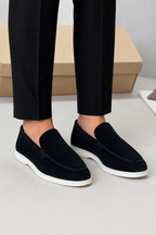 Men's slip-on loafers with moc toe stitching and low white soles