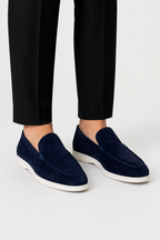 Men's slip-on loafers with moc toe stitching and low white soles