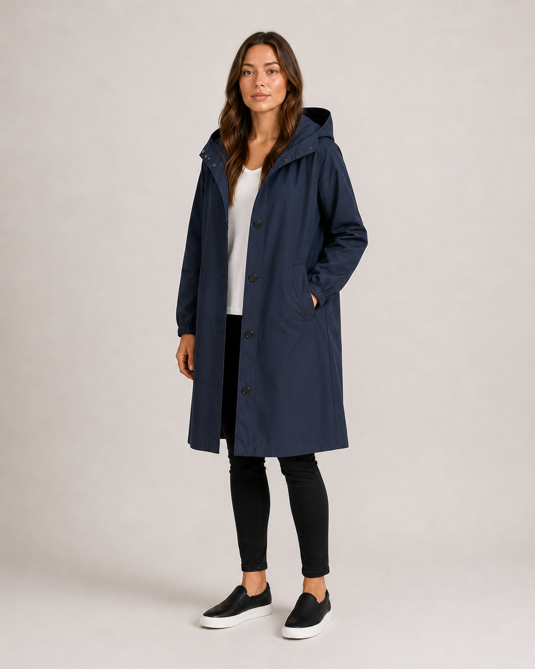Women's hooded mid-length rain coat with button front and side pockets