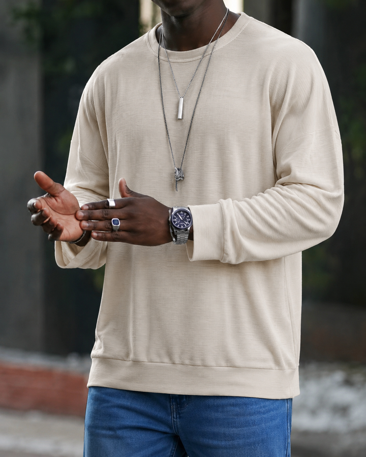 Men's textured knit sweater with crew neckline and long sleeves