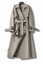 Women's long belted double-breasted trench coat with wide collar and cuff straps