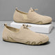 Men's slip-on moccasin loafers with toggle lace detail and flat segmented soles