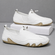 Men's slip-on moccasin loafers with toggle lace detail and flat segmented soles