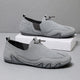 Men's slip-on moccasin loafers with toggle lace detail and flat segmented soles