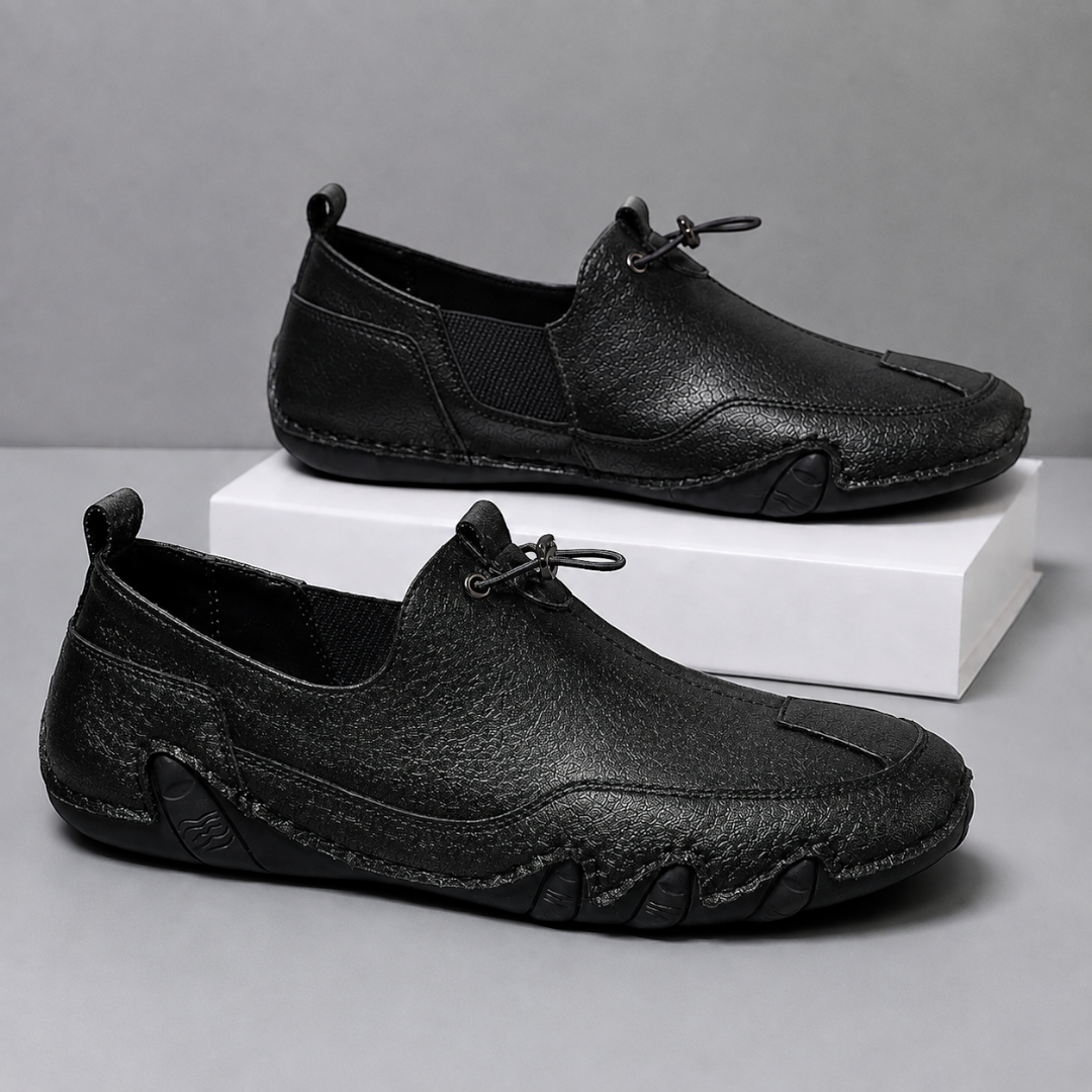 Men's slip-on moccasin loafers with toggle lace detail and flat segmented soles