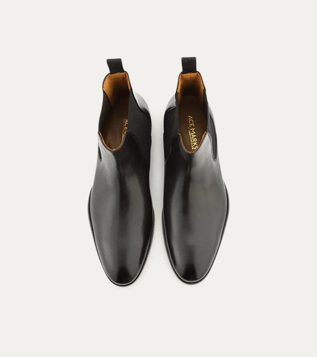 Black Chelsea boot with elastic side panel and low heel