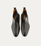 Black Chelsea boot with elastic side panel and low heel