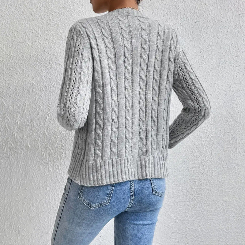Women's textured cable knit cardigan with round neck and button front