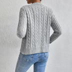Women's textured cable knit cardigan with round neck and button front