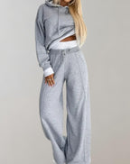 Women's hooded two-piece set with wide-leg trousers and contrasting ribbed cuffs