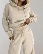 Women's hooded two-piece set with wide-leg trousers and contrasting ribbed cuffs