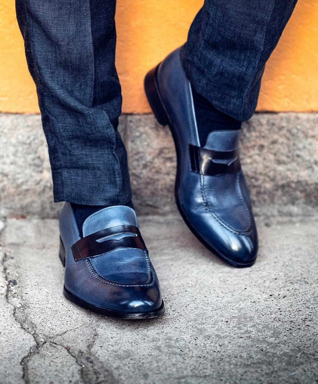 Blue penny loafers with square toes and low stacked heels