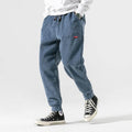 Men's ribbed corduroy jogger trousers with elasticated ankle cuffs and drawstring waist