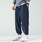 Men's ribbed corduroy jogger trousers with elasticated ankle cuffs and drawstring waist