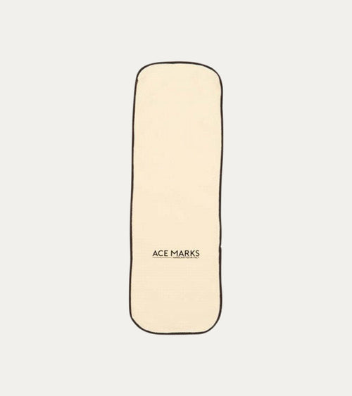Cream rectangular polishing cloth with dark bound edges