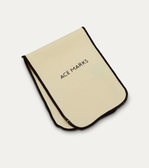 Cream rectangular polishing cloth with dark bound edges