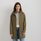 Women's hooded mid-thigh trench coat with long sleeves and zip fastening