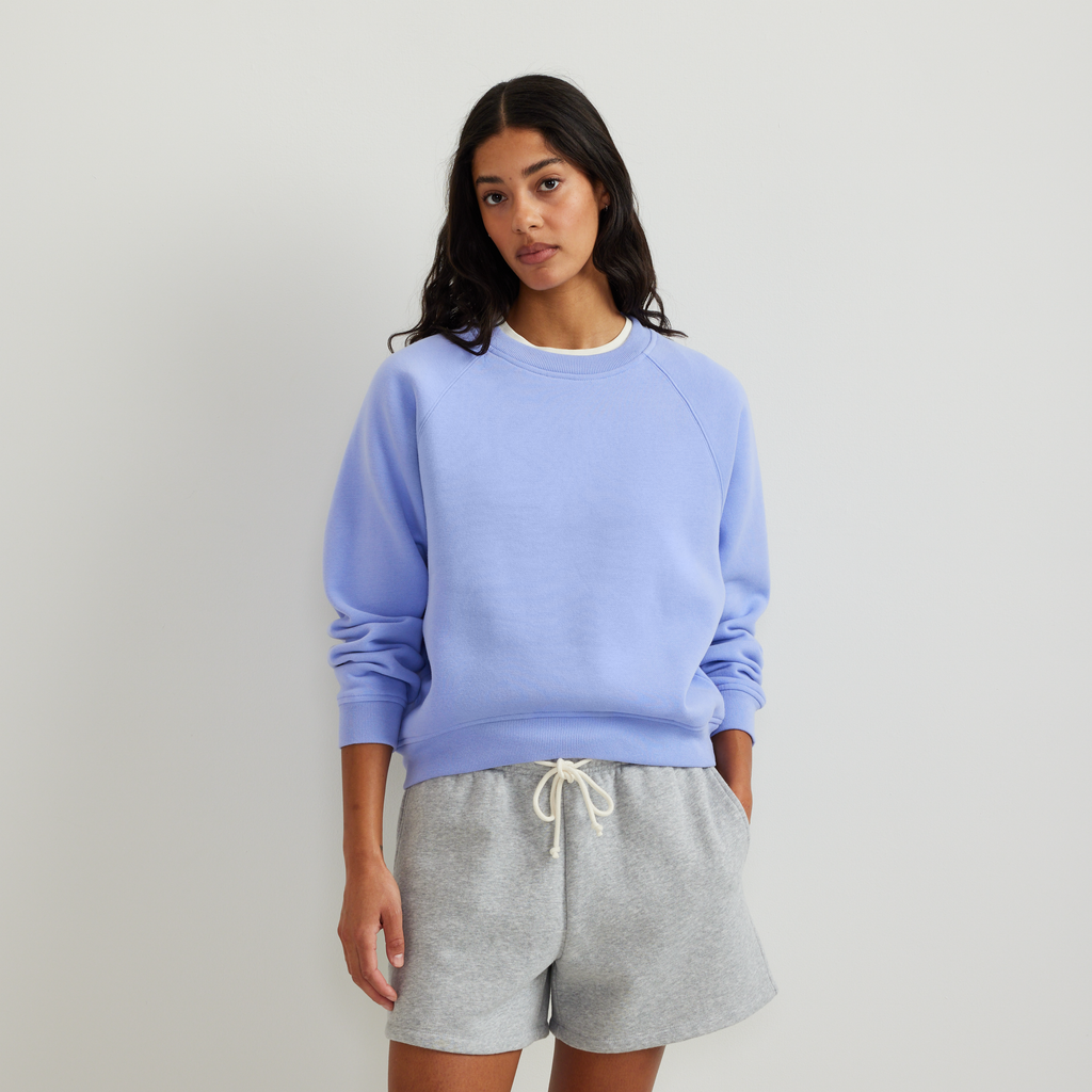 Women's crew neck sweatshirt with long raglan sleeves and ribbed trims