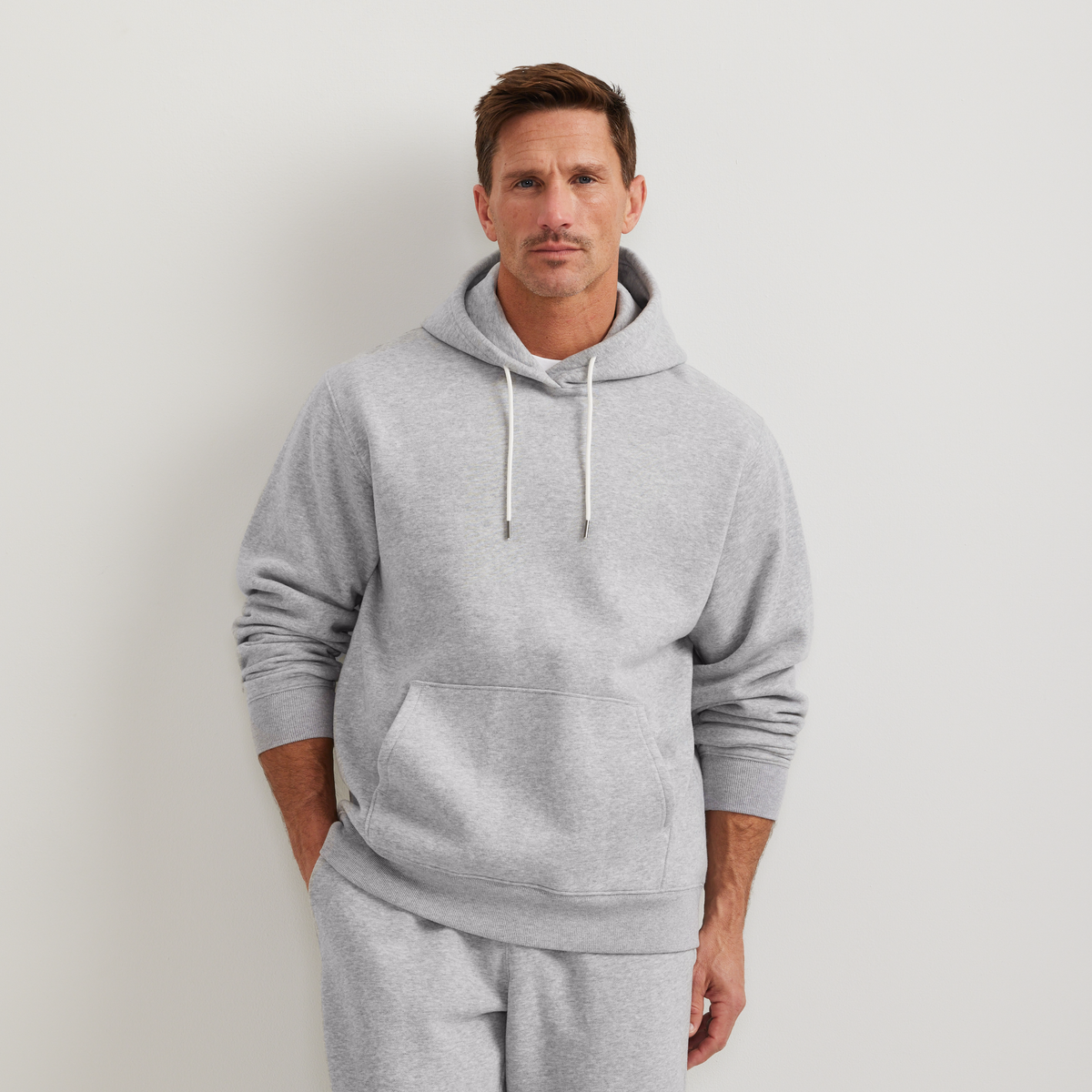 Men's plain pullover hoodie with drawstring hood and front kangaroo pocket