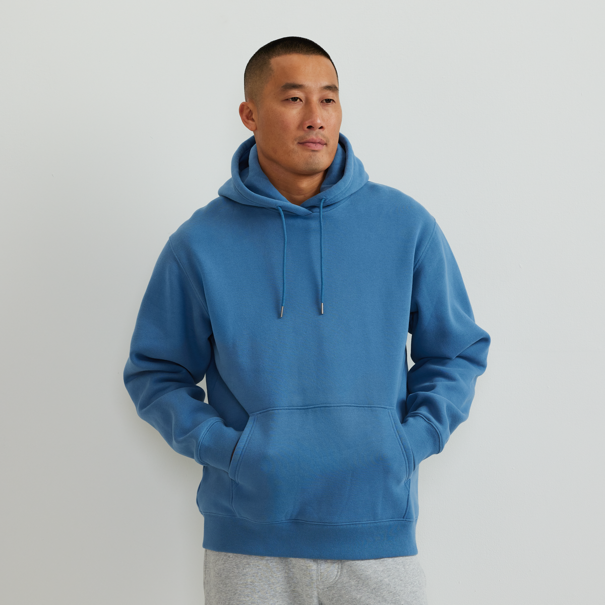 Men's plain pullover hoodie with drawstring hood and front kangaroo pocket
