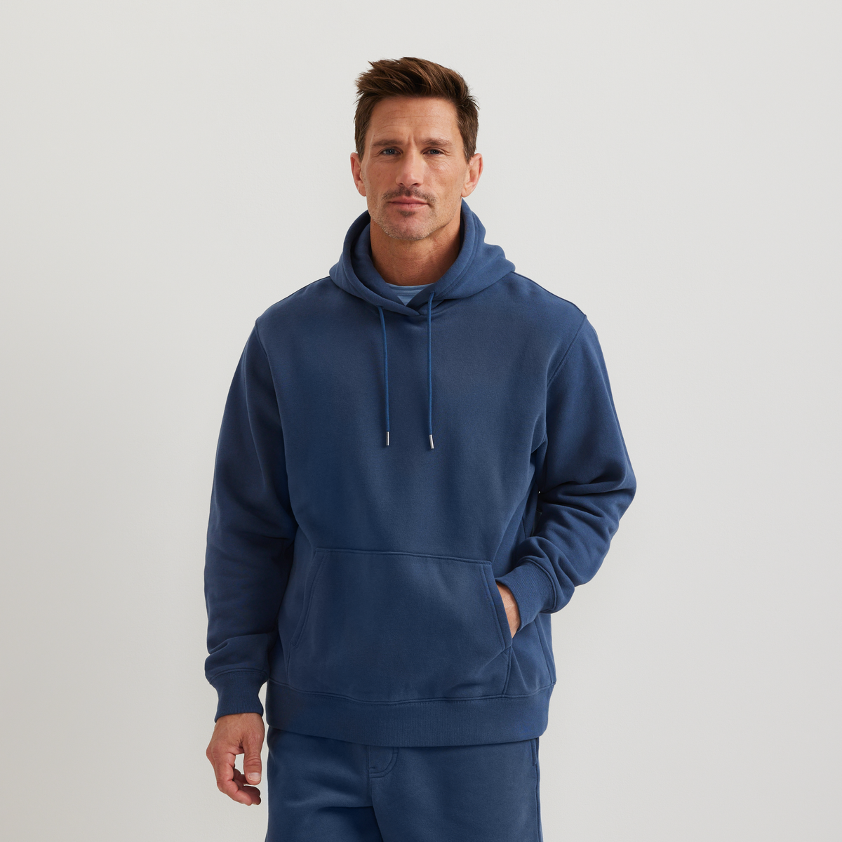Men's plain pullover hoodie with drawstring hood and front kangaroo pocket