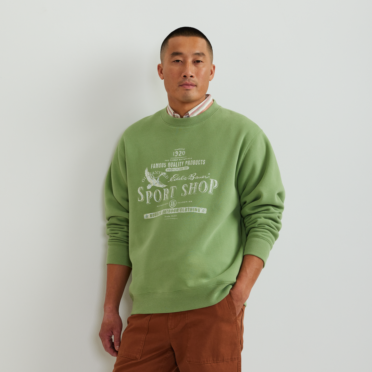 Men's green crew-neck sweatshirt with vintage Sport Shop graphic and long sleeves