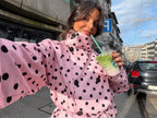 Women's pink cropped polka dot trench coat with high collar and waist tie