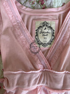 Women's wrap babydoll top with long sleeves and waist ties