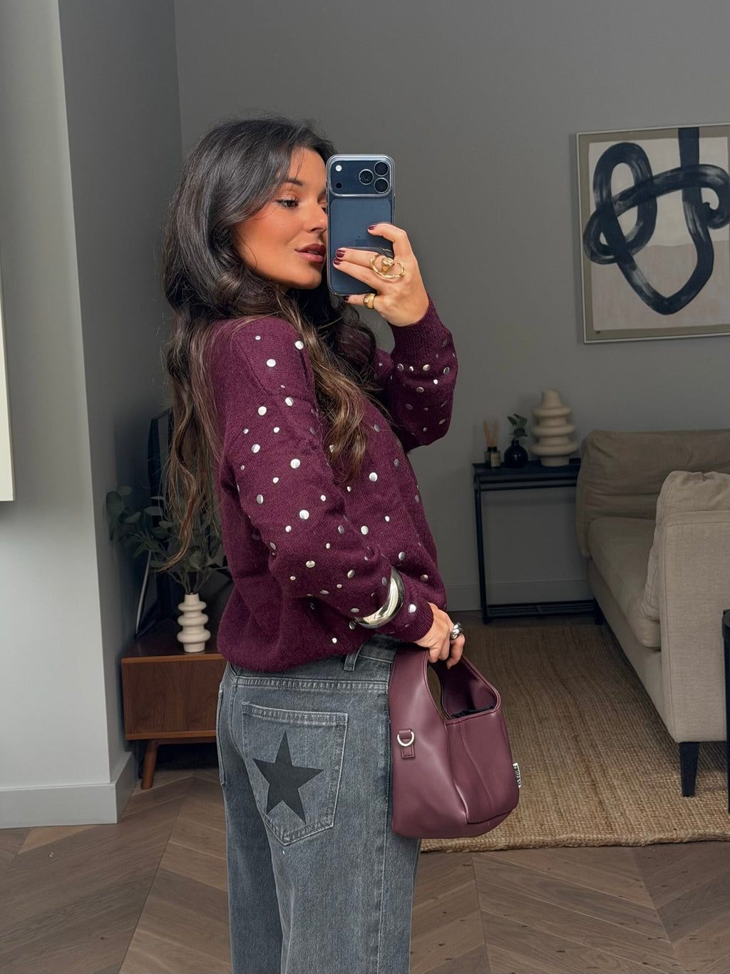 Women's burgundy sweater with scattered silver stud embellishments