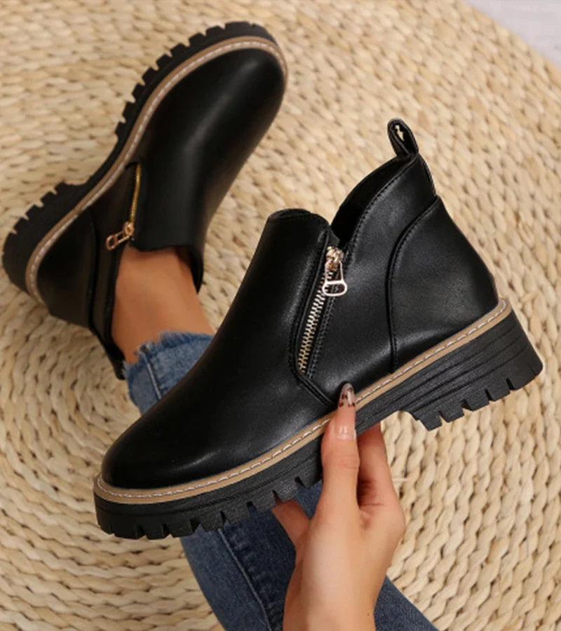 Women's ankle boots with side zips, rounded toes and chunky lug soles