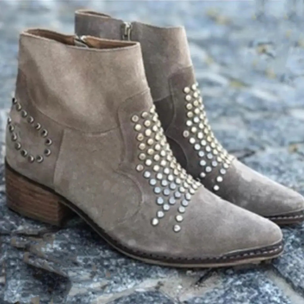Beige ankle boots with pointed toes, low block heels and metallic studded panels