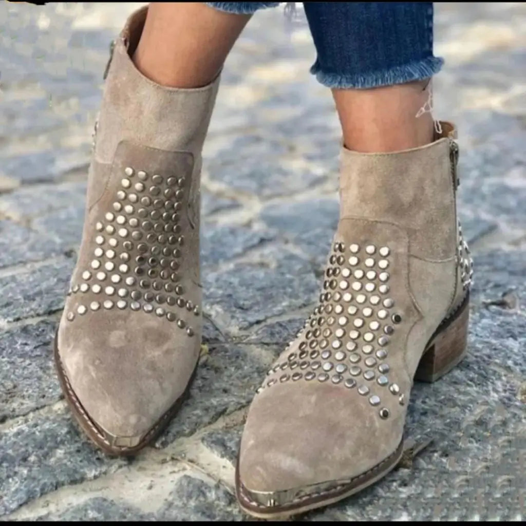 Beige ankle boots with pointed toes, low block heels and metallic studded panels