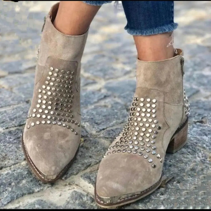 Beige ankle boots with pointed toes, low block heels and metallic studded panels