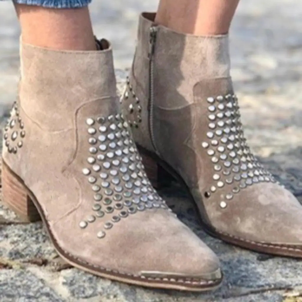 Beige ankle boots with pointed toes, low block heels and metallic studded panels