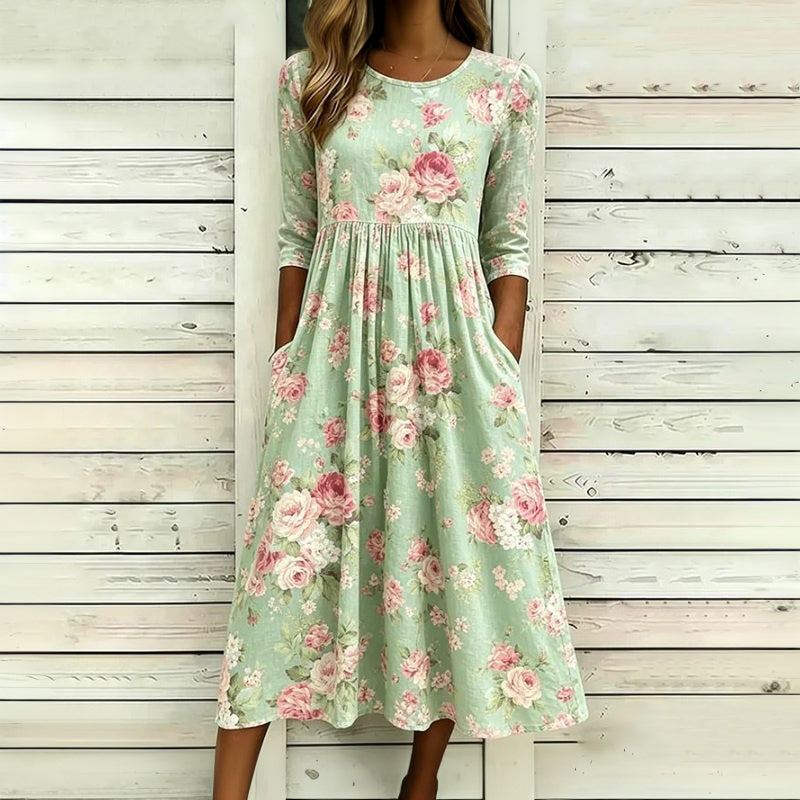 Green floral midi dress with round neck and three-quarter sleeves