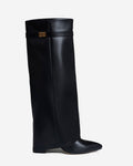 Women's black knee-high boots with pointed toes and buckle strap