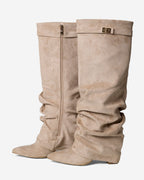 Women's beige slouchy knee-high boots with buckle strap