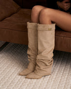 Women's beige slouchy knee-high boots with buckle strap