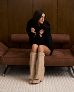 Women's beige knee-high boots with pointed toes and buckle straps