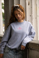Women's light grey crewneck sweatshirt with pink chest logo