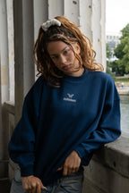 Women's navy crew neck sweatshirt with chest logo