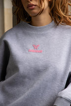 Women's light grey crewneck sweatshirt with pink chest logo