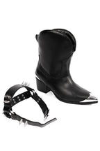 Women's black cowboy boots with silver toe caps and spiked straps