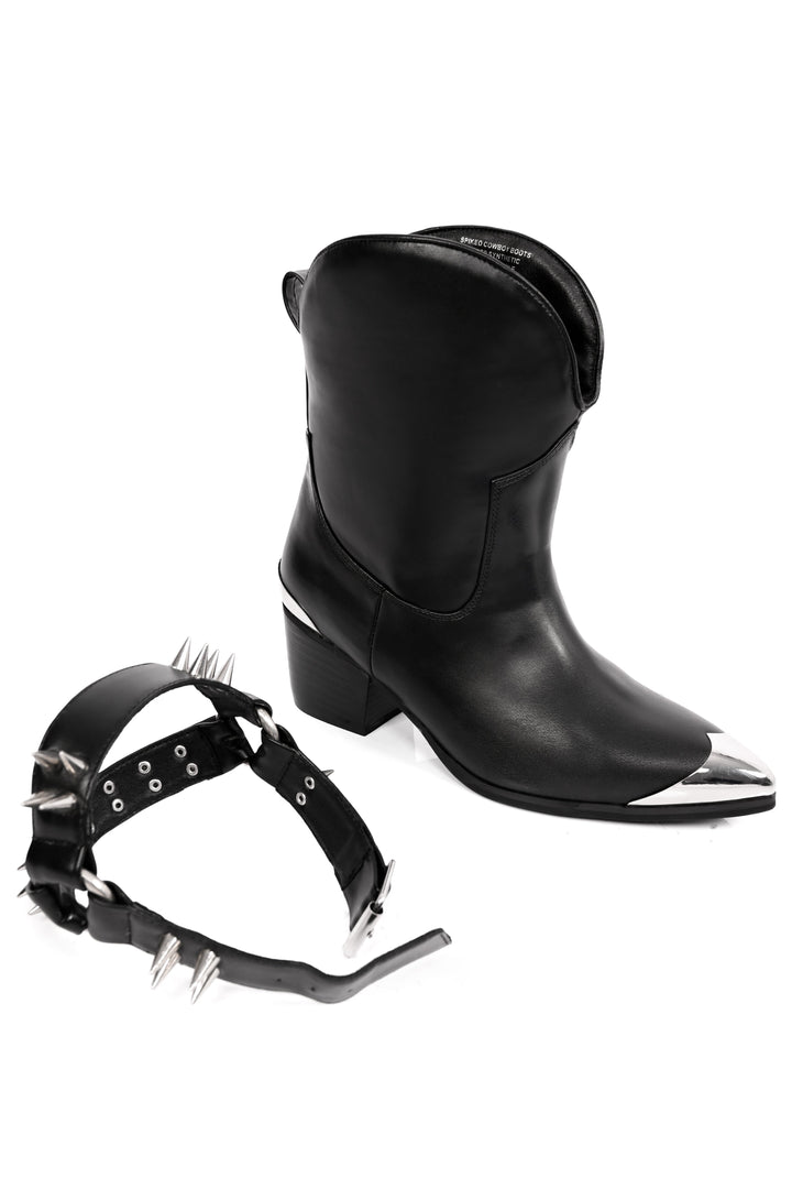 Women's black cowboy boots with silver toe caps and spiked straps