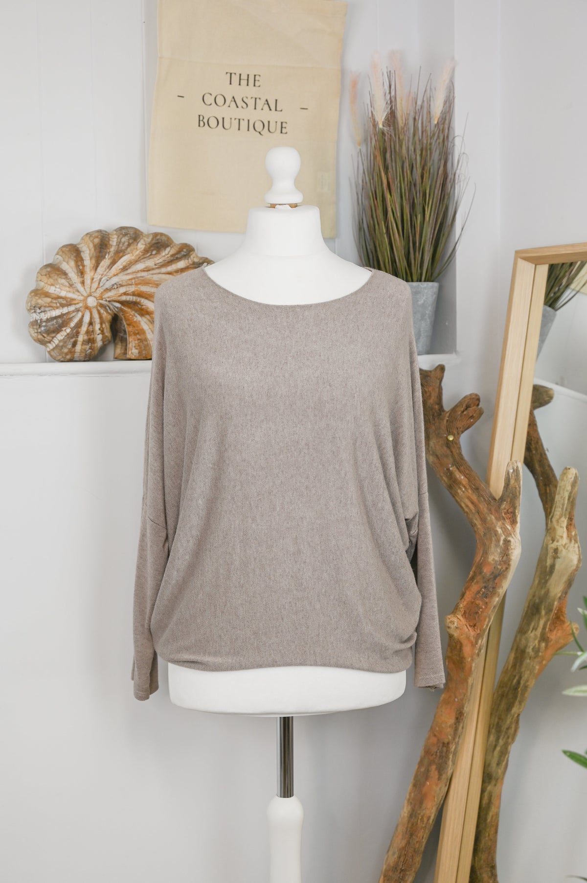 Women's long-sleeved round neck knitted jumper on a mannequin