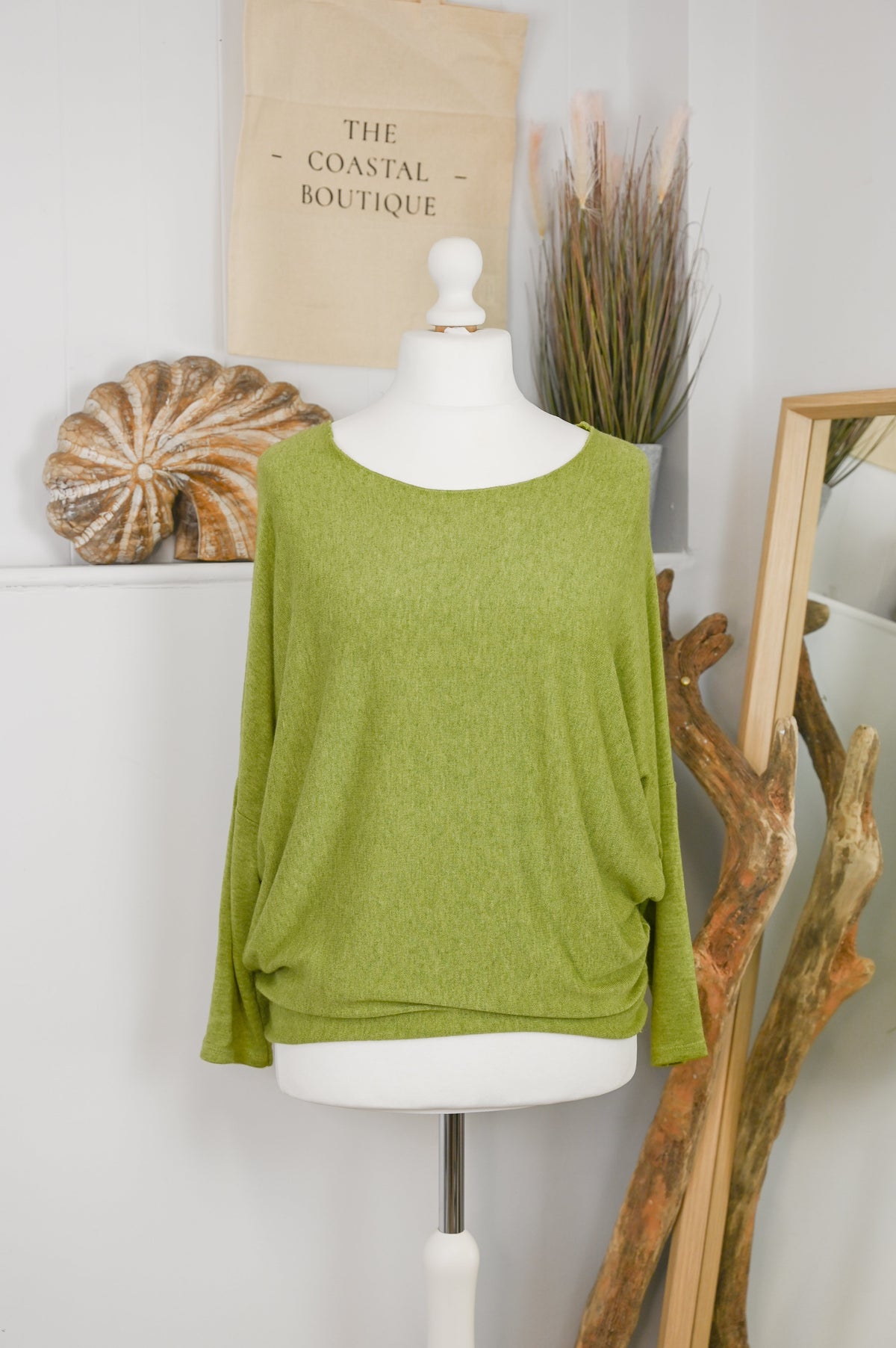 Women's long-sleeved round neck knitted jumper on a mannequin