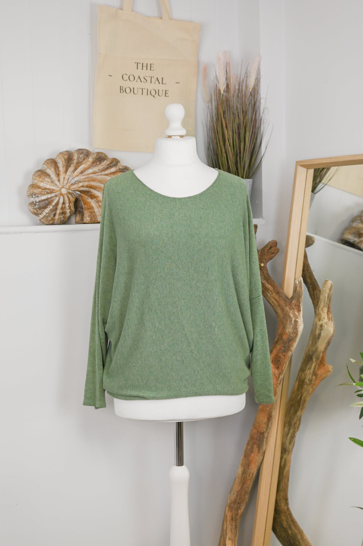 Women's long-sleeved round neck knitted jumper on a mannequin