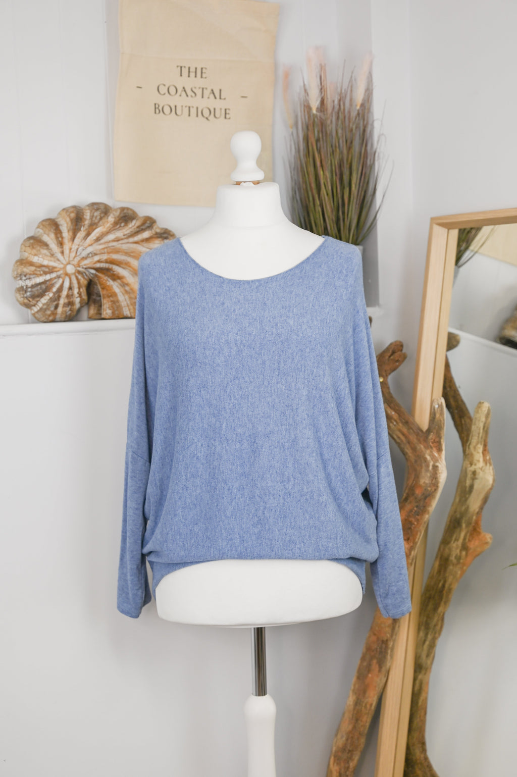 Women's long-sleeved round neck knitted jumper on a mannequin