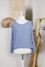 Women's long-sleeved round neck knitted jumper on a mannequin
